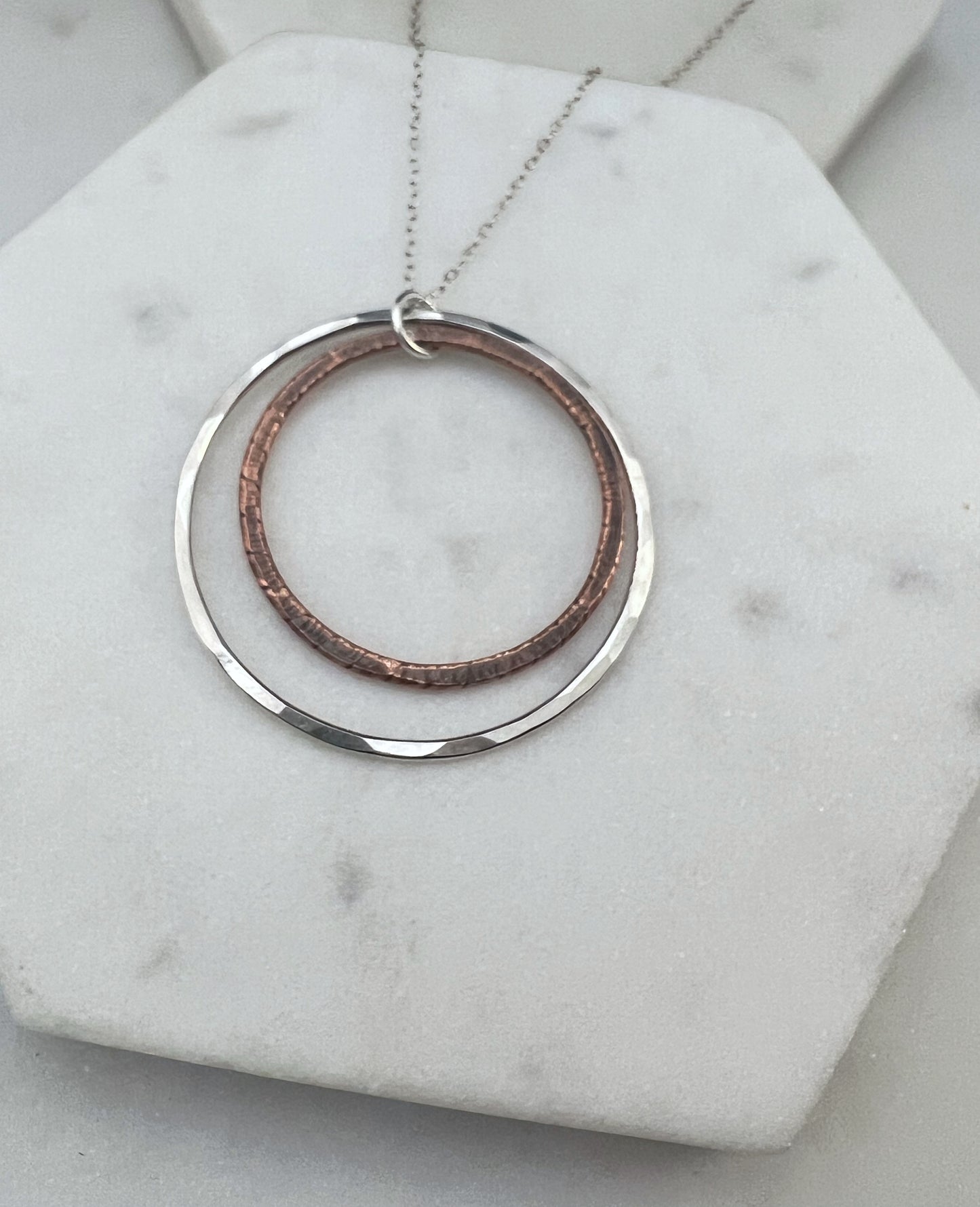 Sterling silver and copper forged hoop necklace