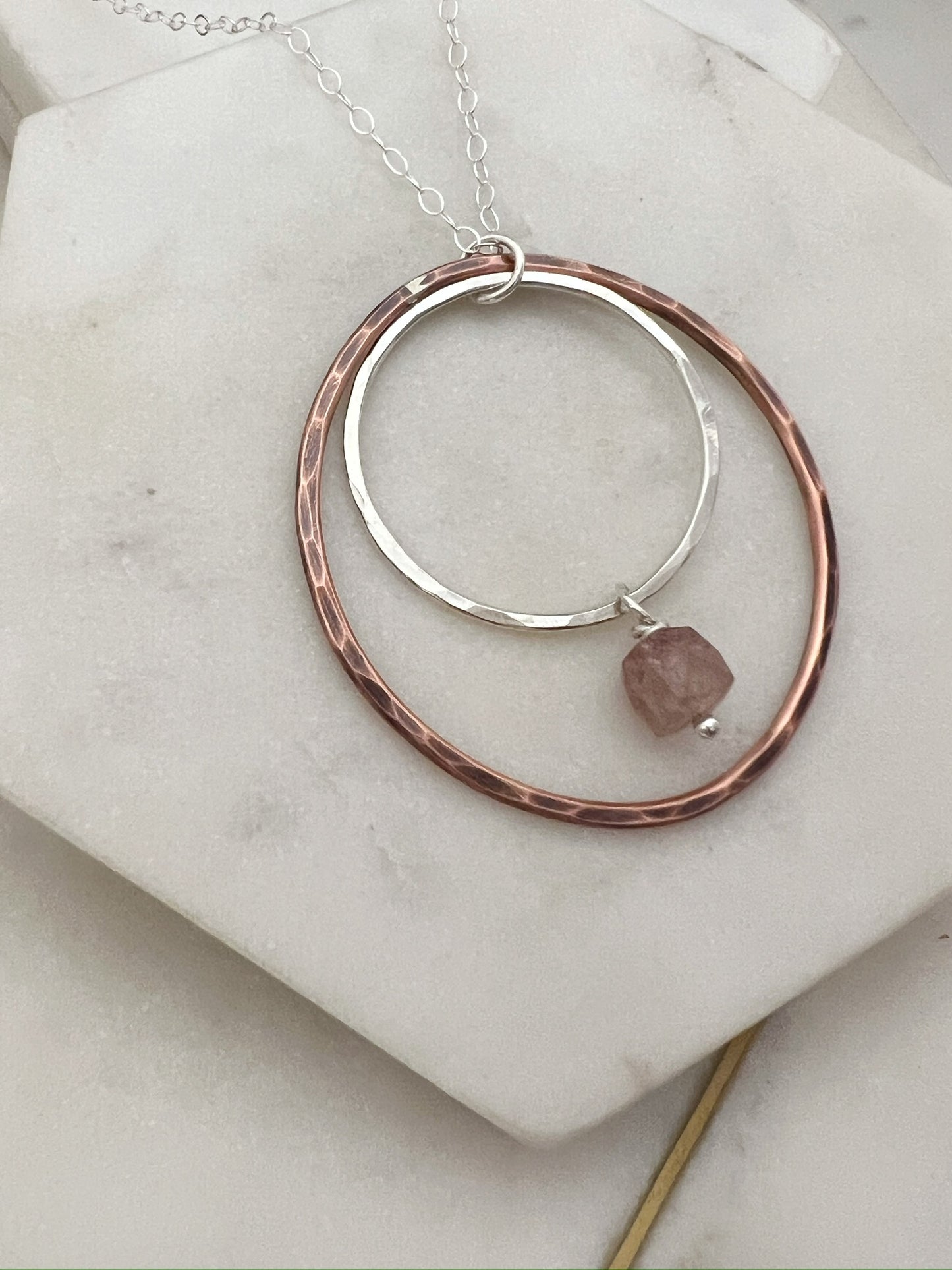 Sterling silver and copper forged hoop necklace with strawberry quarts