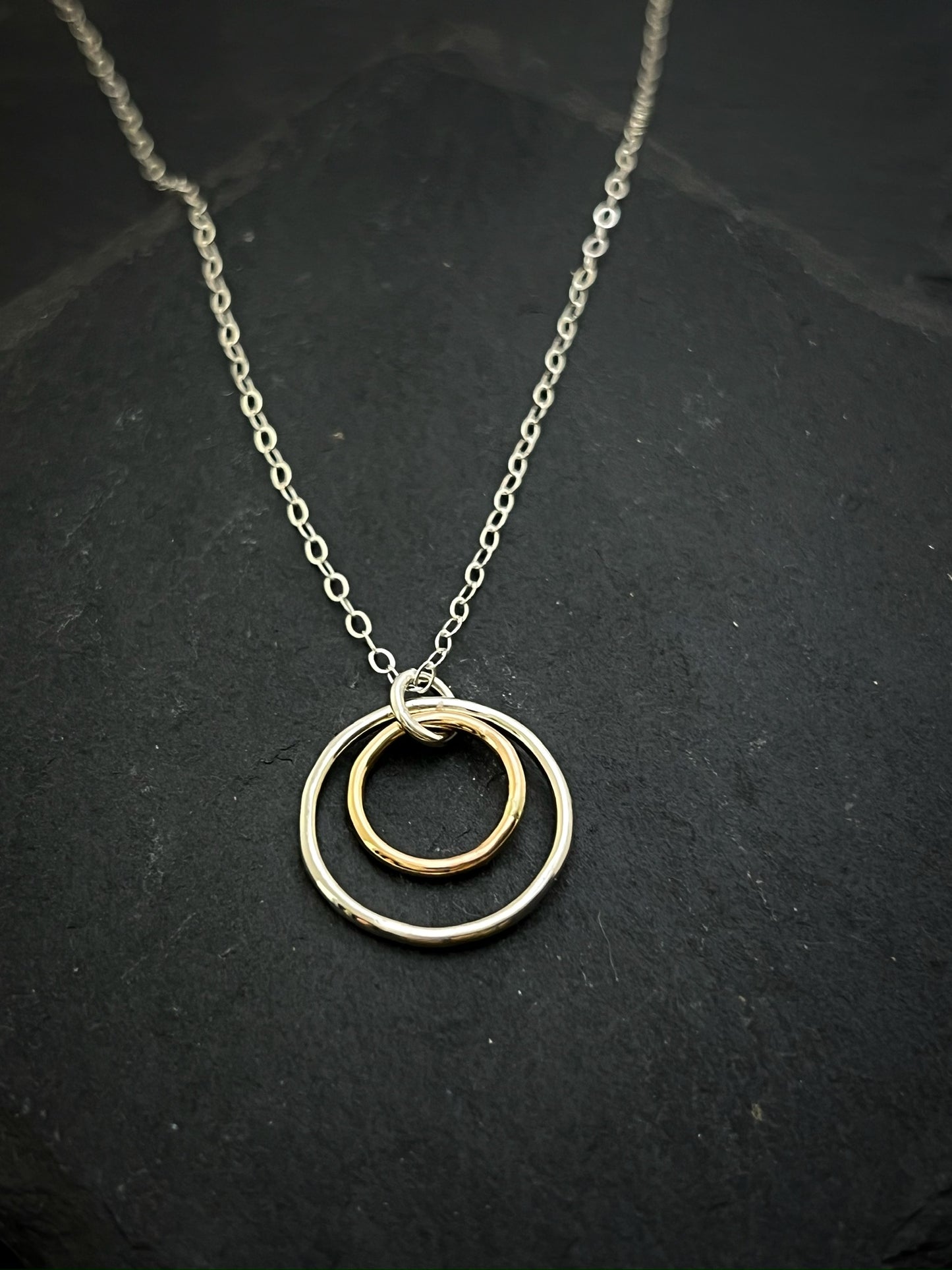 Forged sterling silver and 14 karat gold dainty double hoop necklace