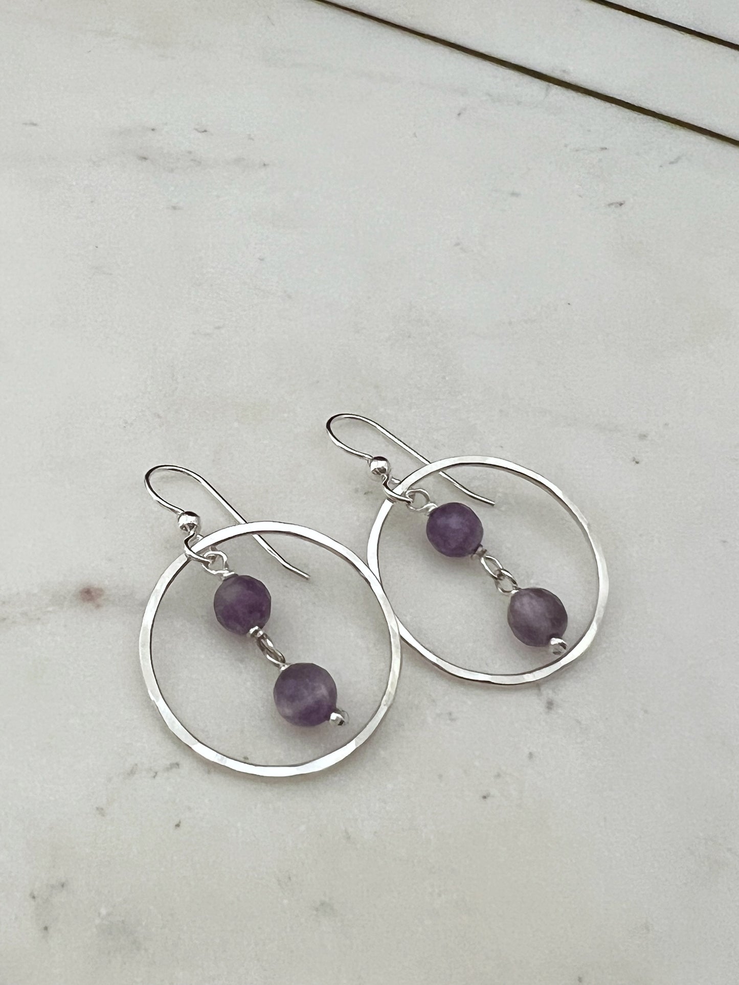 Sterling silver hoop earrings with amethyst gemstones