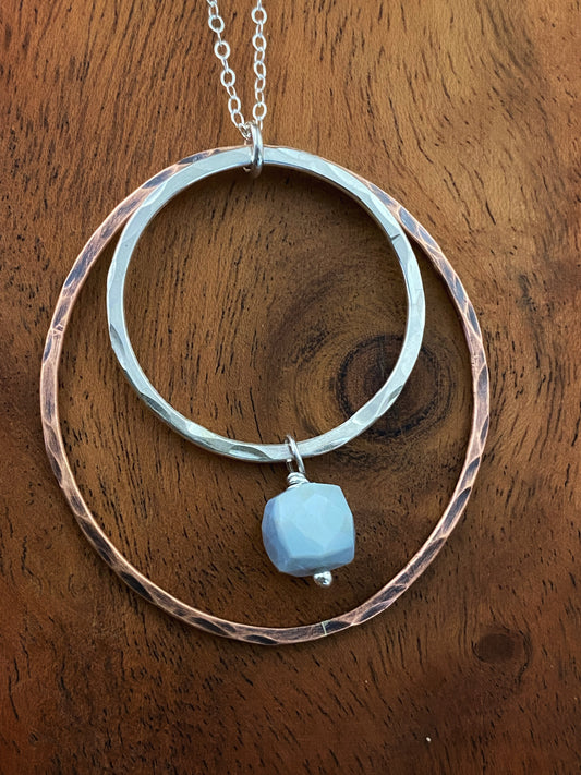 Sterling silver and copper forged hoop necklace with blue opal